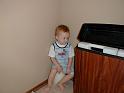 zack in master bedroom-sitting on the candle